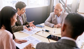 Meeting of tech partners around a conference table