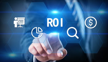 Business person selecting ROI on a touchscreen