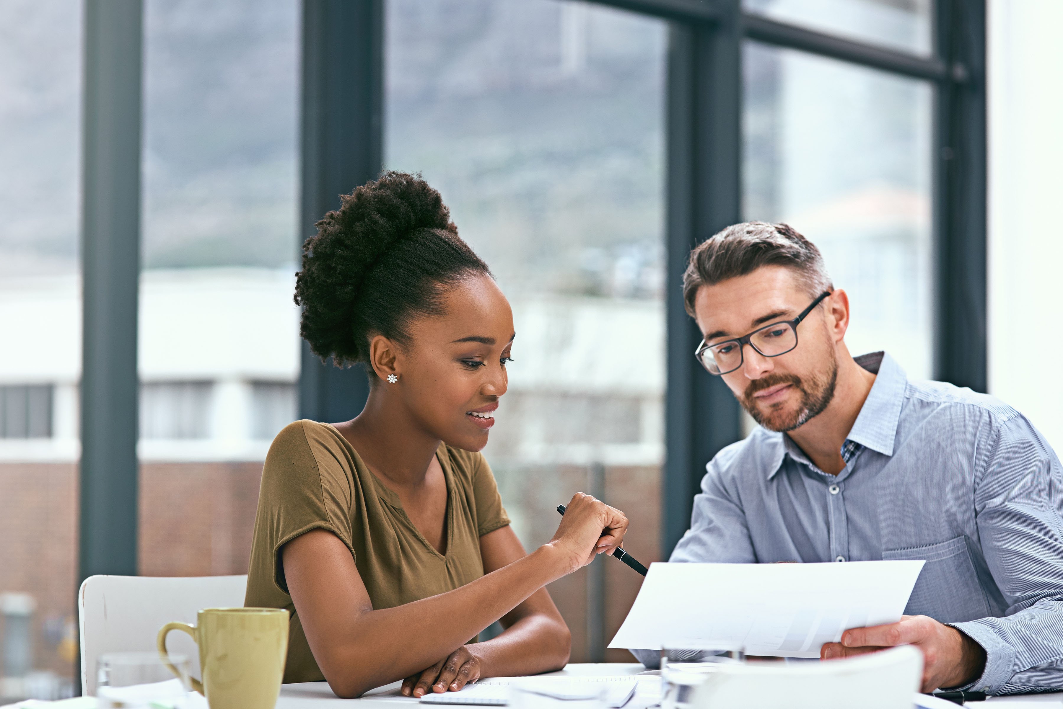 Two colleagues having a meeting in an office