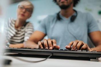 person typing on a keyboard